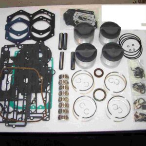 A table with many different parts of a engine.