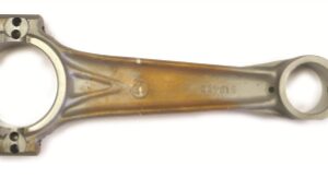 A close up of the bottom end of an old spoon