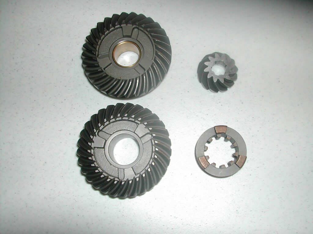 A set of gears and parts for an engine.