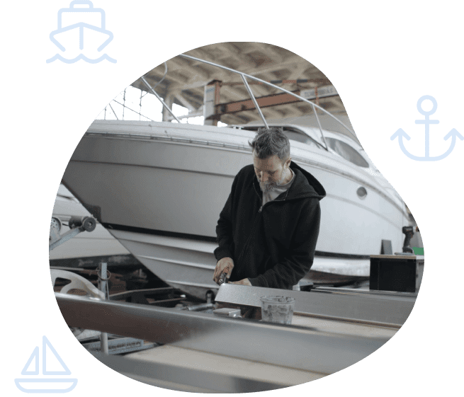 A man standing in front of a boat.