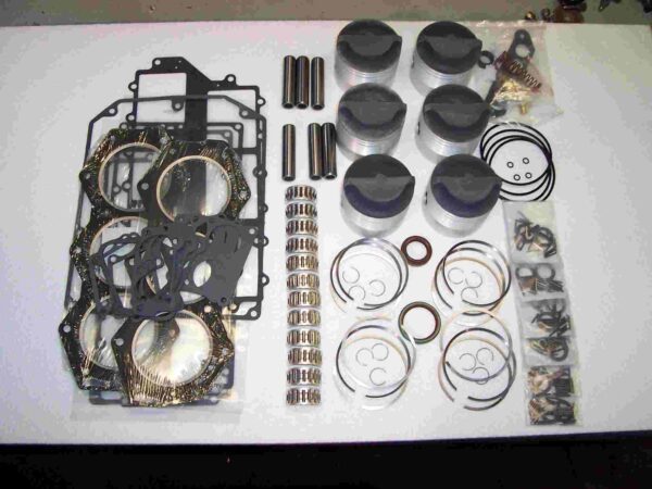 A table with many different parts of a car engine.