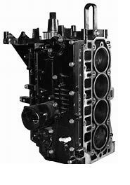 A black and silver engine block with four valves.