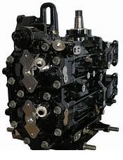 A black engine with many parts attached to it.