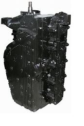 A black engine block with many rivets on it.